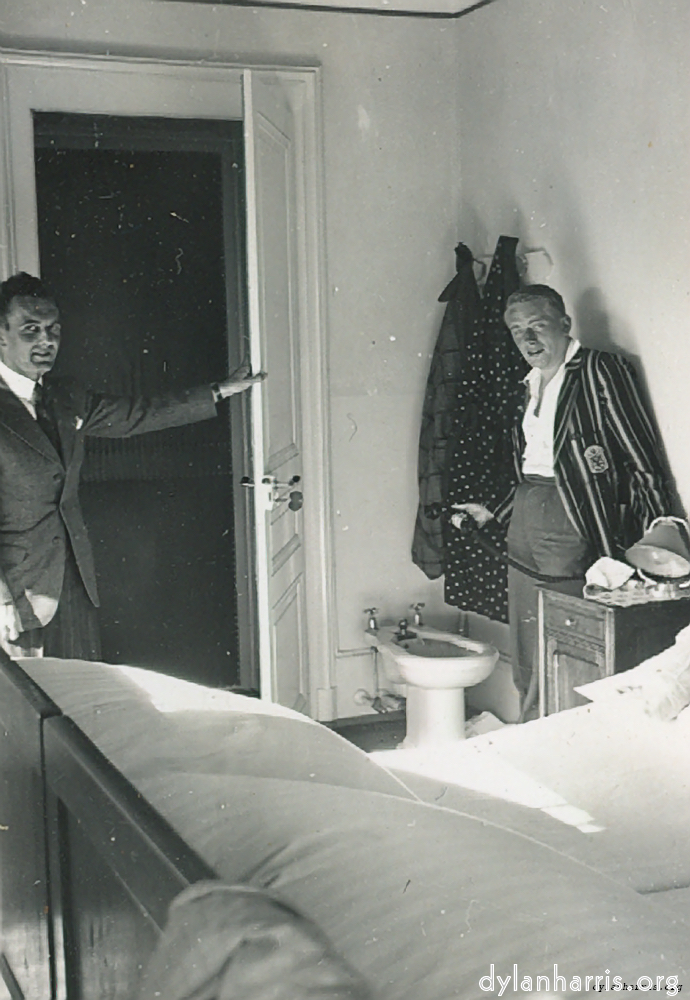 image: Ray and Phil in our Room, No. 33, at Hotel Terminus, Neuch&acirc;tel. Note Padded Outer door, huge key, etc., etc.!