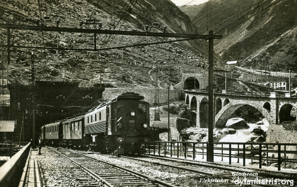 image: Postcard: G&ouml;schenen Elektrischer Zug der Gotthardbahn. [[ St. Gotthard Tunnel G&ouml;schenen Entrance with the Sch&ouml;llenenbahn Rack Railway to Andermatt etc. ]]