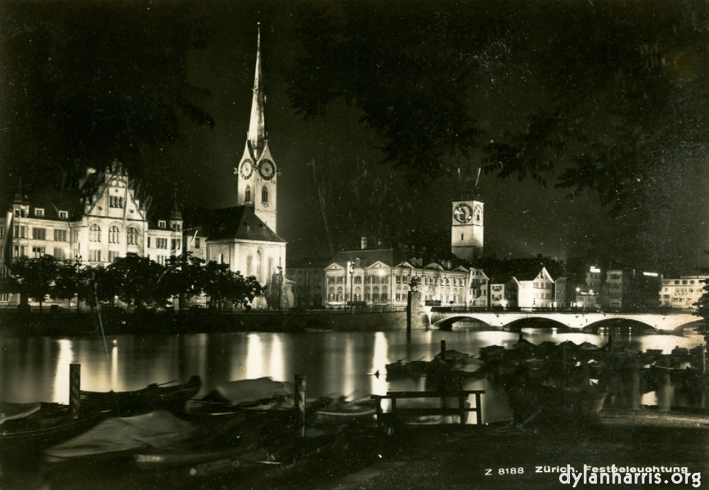 image: Postcard: Z 8188 Z&uuml;rich. Festbeleuchtung [[ Z&uuml;rich by Night: St. Peters Church and the Urania Observatory from the Lummatquai. ]]