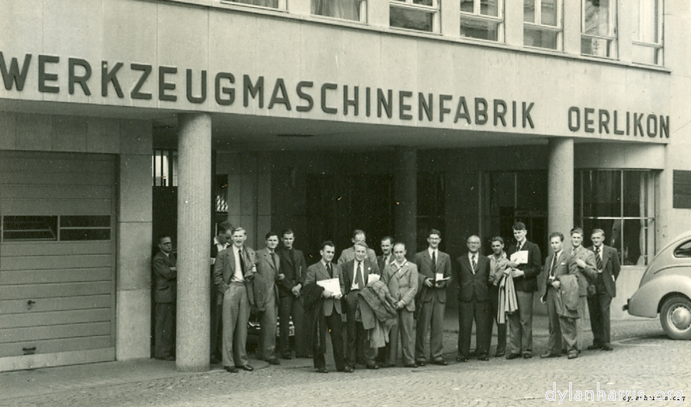 image: Some of the I.E.E. Party. At the main entrance to Werkzeugmaschinenfabrik Oerlikon Buhle & Co. Oerlikon. Z&uuml;rich. 19 August 1948.
